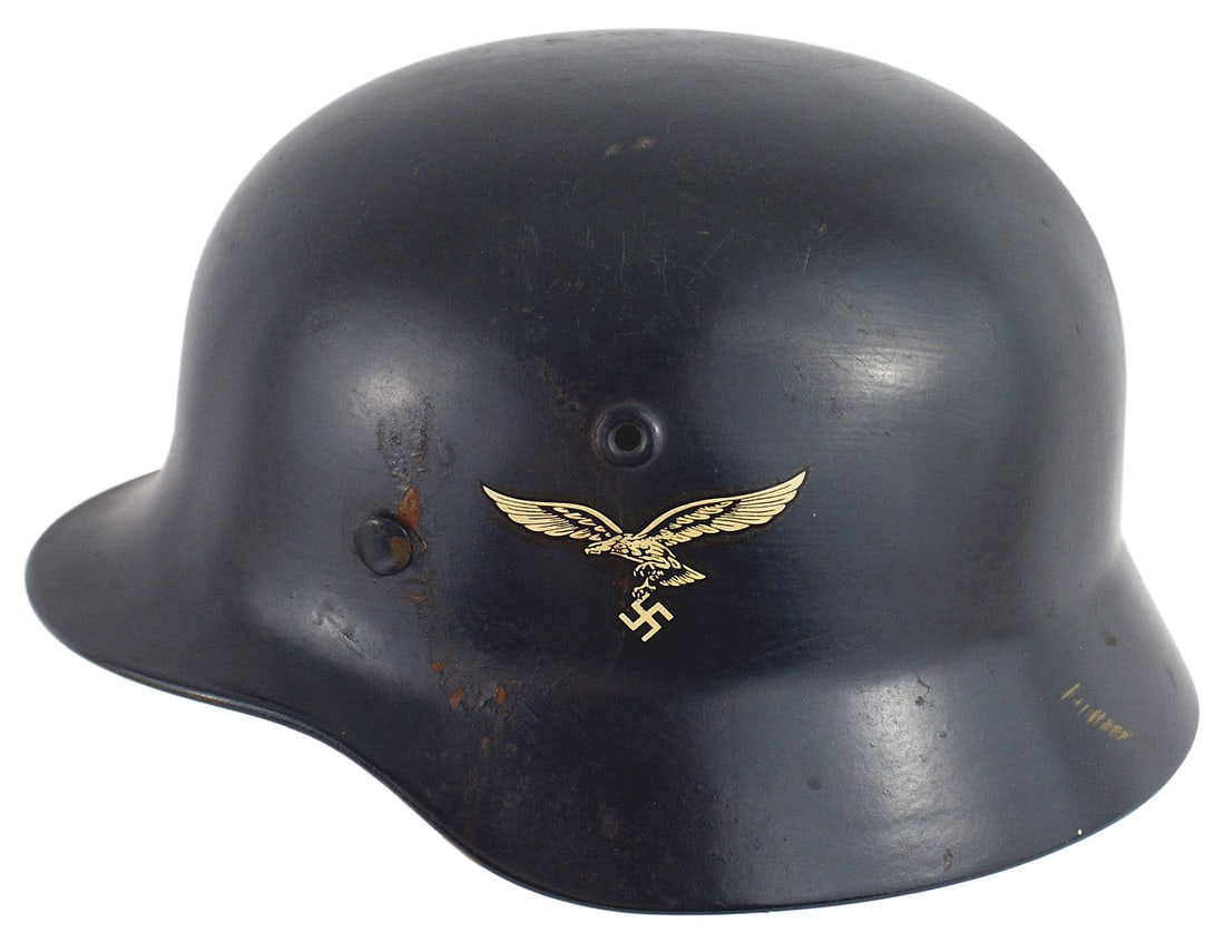 Restored German WWII Luftwaffe helmet: E-021 Restored German WWII Luftwaffe double-decal M1935 helmet. Repainted blue-gray with non period decals. Replaced little used leather liner. Chinstrap marked "...LINGERFELD 1942". A good display it