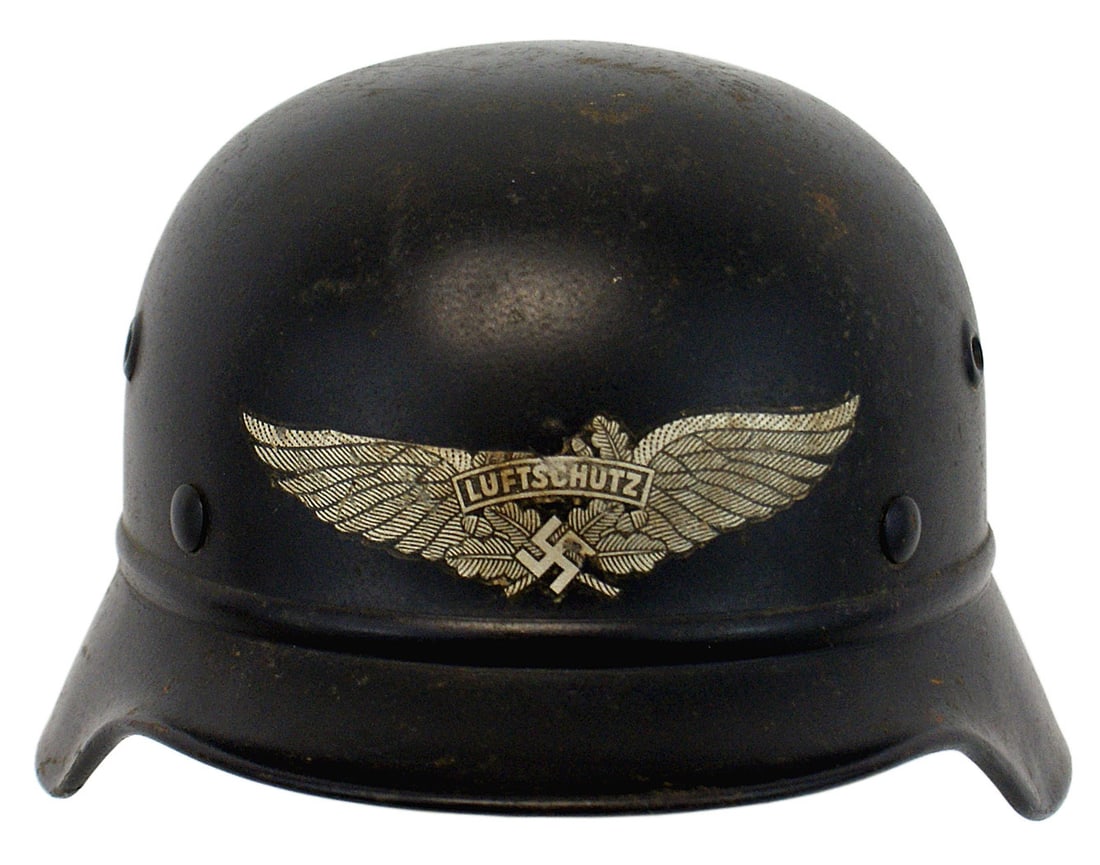 German WWII Luftschutz M1940 helmet: E-025 German Third-Reich/WWII Luftschutz M1940 helmet, but with a ring around the base of the skull. Original dark blue finish shows some expected scratches. Large, winged swastika with "LUFTSCHUTZ" d
