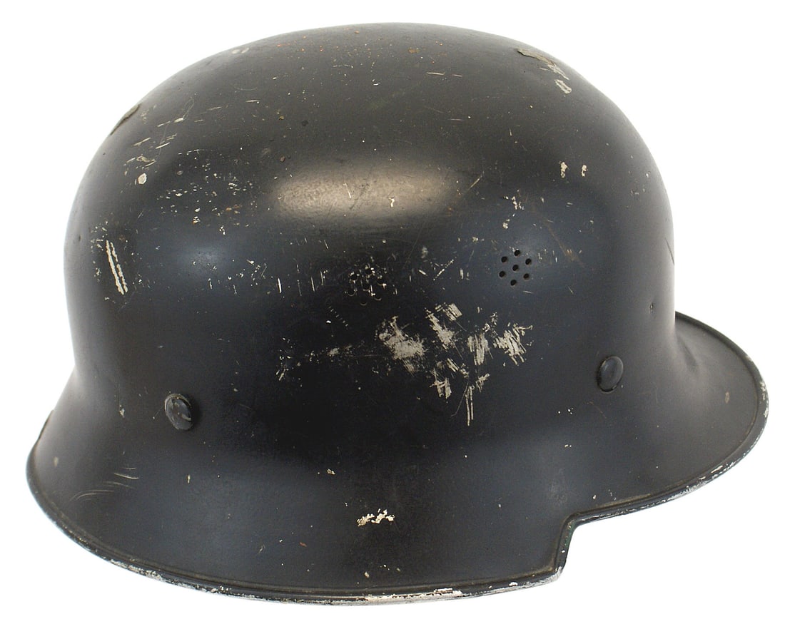 German WWII Civil Police lightweight helmet: E-030 Third-Reich Civil Police double decal, lightweight helmet. Three plug slots where an aluminum comb was removed. Black finish shows scratching. Double stamped air vents. Swastika decal was remove