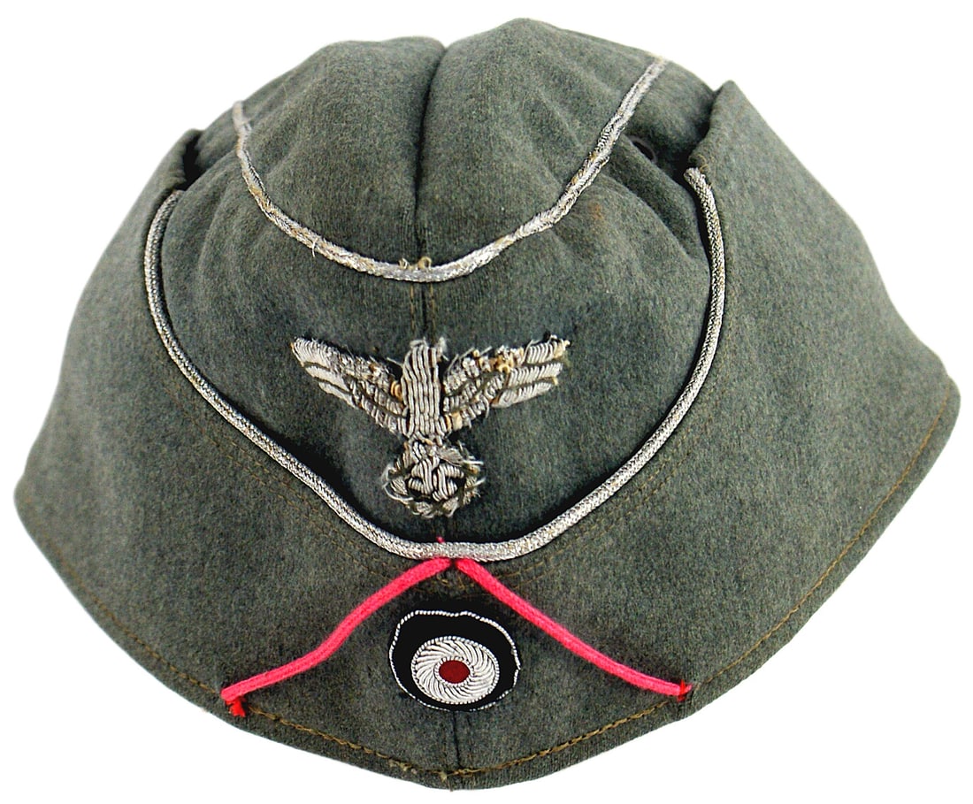 German WWII Panzer Officer overseas cap: E-042 German WWII Panzer Officer's o'seas cap. O.D. "doeskin" material with silver cord piping, silver bullion eagle/swastika (no cloth backing), bullion rosette and pink soutache. Some moth tracking 