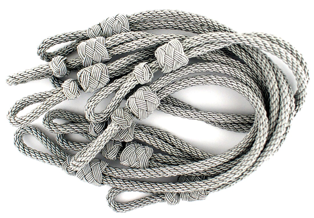 Lot of 5 German WWII cap cords: E-048 Lot of 5 German Third-Reich Army/Luftwaffe officer's silver cap cords. All in excellent condition. I