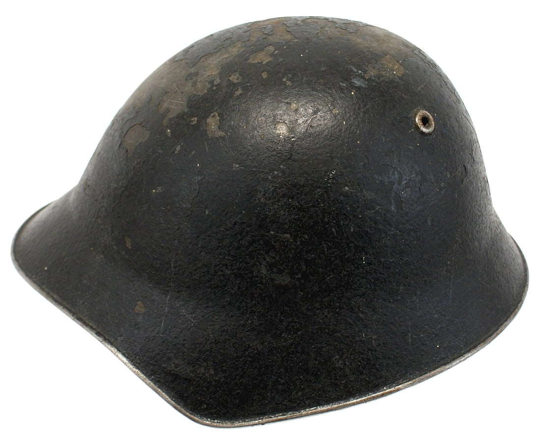 Swiss helmet circa 1920s-1930s WWII: E-077 Swiss helmet. Dark O.D. "sawdust" finish. Top front and top back have chipped patches. Two relief doughnuts on top back act as vents. Liner consists of a cloth covered band with three leather "p