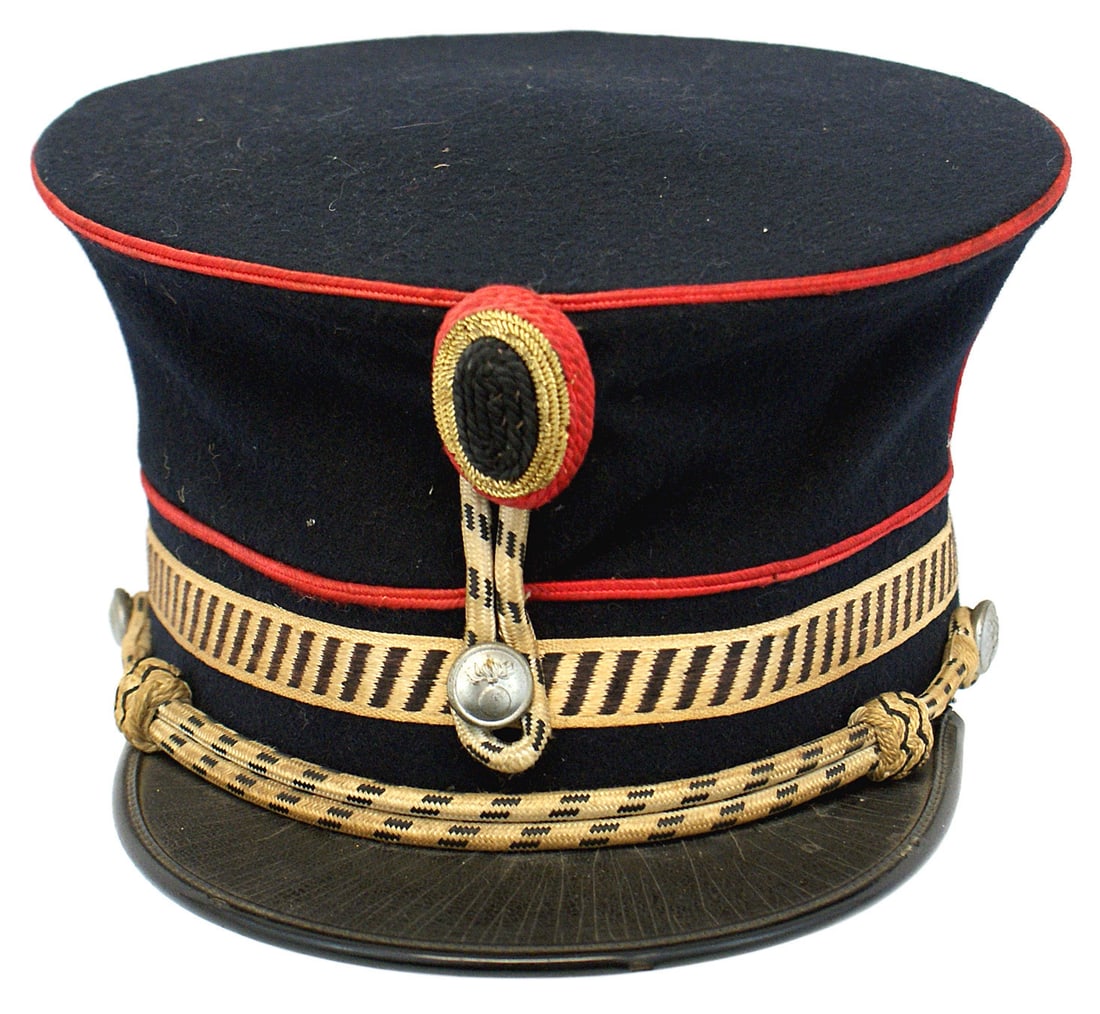 Dutch WWI era hat shako: E-079 Dutch WWI era hat/shako. 5 1/8" tall, inverted bell shape. Quality black wool body with red piped band and crown connected by three vertical red stripes. Also, a 5/8" wide light gold band with s