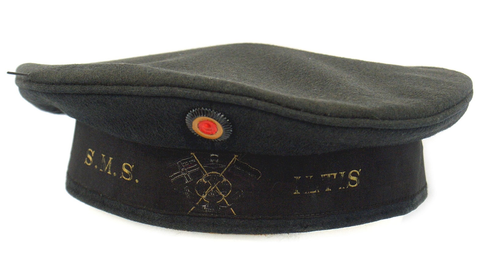 Imperial German WWI Navy EM Donald Duck cap: E-080 Imperial German/WWI Navy E.M. "Donald Duck" cap. Original black cap tally has ships name "S.M.S. Iltis" and crossed War and National flags. Also National rosette. Original navy-blue color turned