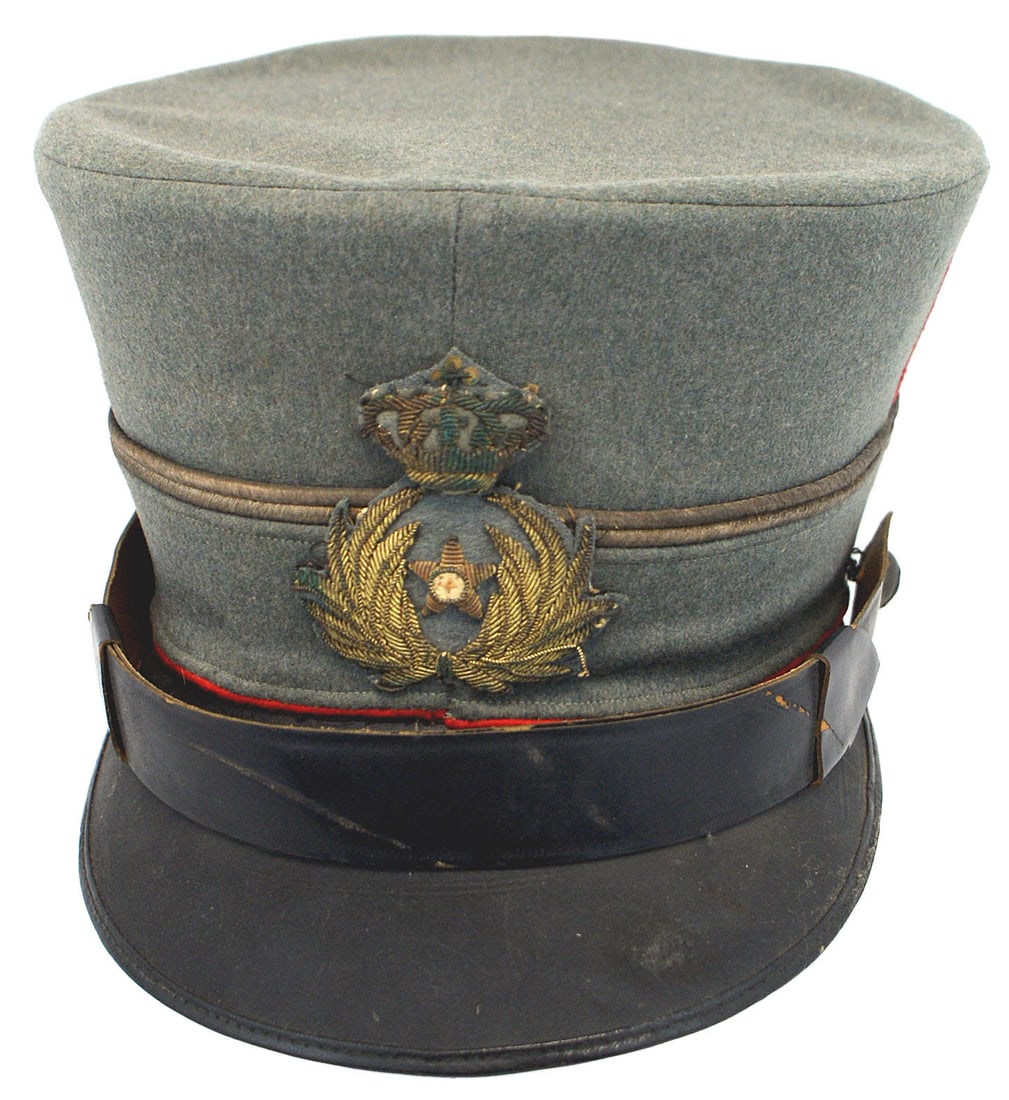 Italian WWI officer dress cap: E-083 Italian WWI officer's dress cap. Fine quality blu-gray doeskin material. 5" tall inverted "bucket" shape with a top slanted inward. Double age toned silver cord circling the center of the hat wi