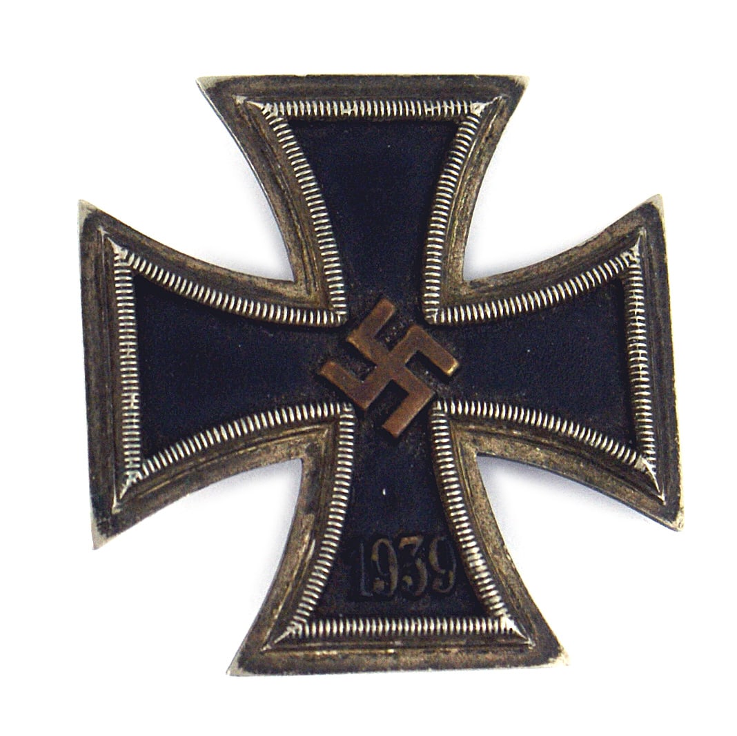 German WWII Navy 1939 Iron Cross 1st Class: B-052 German WWII Navy 1939 Iron Cross 1st Class. Black finish worn on a brass high relief swastika actually making it more pronounced. Patina on silver frame, reverse and wide pin. Scarce. II