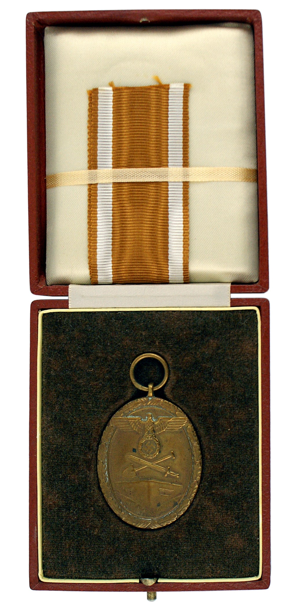 German WWII cased West Wall Medal: B-072 German Third-Reich cased West Wall Medal. Large eagle/swastika, crossed shovel/sword - over a bunker. Awarded to all personnel who helped construct Germany's "West Wall" fortification. Gold lett