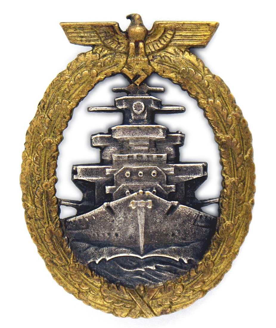 German WWII Navy Service Badge: B-081 German WWII Navy Service Badge. Darkened high relief battleship within an open, age toned gold oak leaf wreath with an eagle/swastika at top. Convex shaped badge has a darkened "dished" gun blue