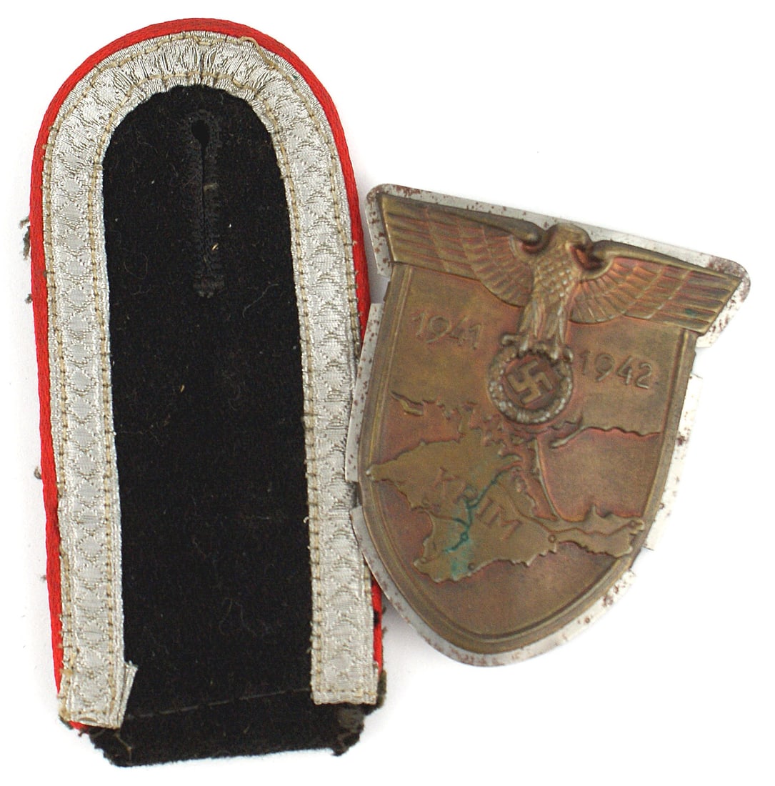 Germany WWII KRIM Shield: B-086 German WWII "KRIM SHIELD", Large eagle/swastika,/1941-1942 over a map of a peninsula marked "KRIM". With a metal backing plate. Also an Army (NCO) Artillery slip-on shoulder board with silver tr