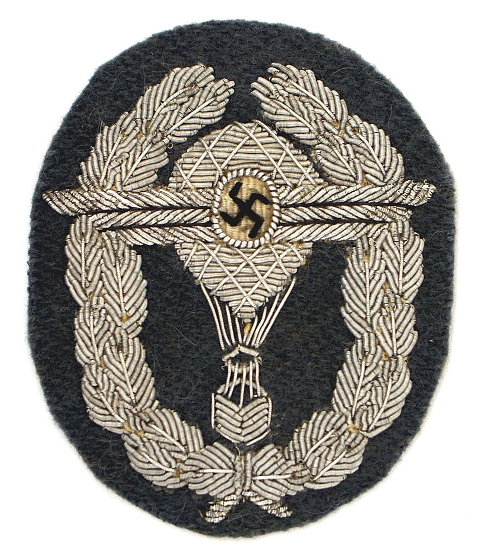 German WWII NSFK Badge Free Balloon Pilot: B-097 Third-Reich N.S.F.K. Badge for Free Balloon Pilot - 1938 1st Design: Blue-gray oval uniform badge with a high quality relief silver embroidered winged swastika/hot air balloon on a bullion embro