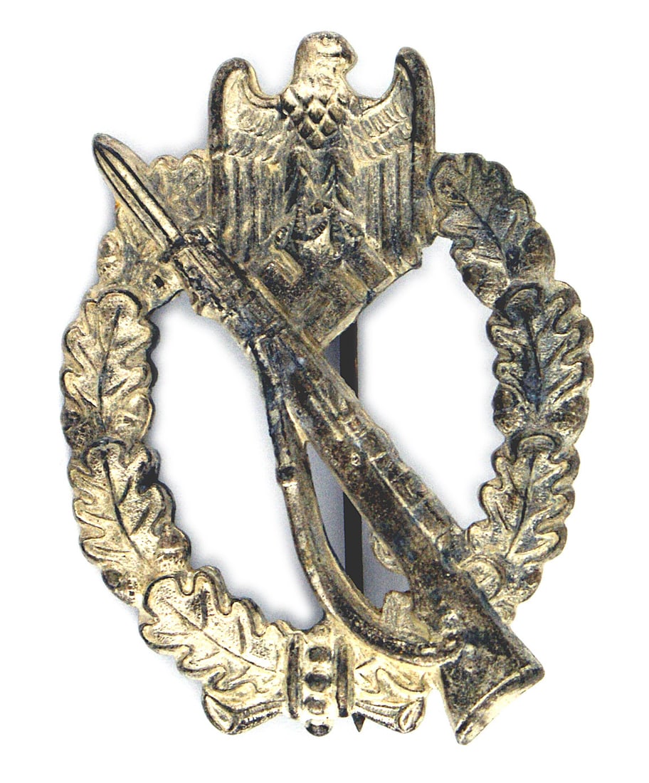 German WWII Infantry Assault Badge Silver: B-100 German WWII Infantry Assault Badge - Silver. Rifle with fixed bayonet on an open wreath and eagle/swastika at the top. Solid type. Approximately 40% of the original silver finish. Maker "R.S." S