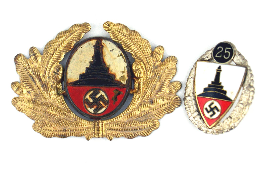 German WWII War Veteran badge wreath: B-108 German Third-Reich "New" style Kyffhauserbund (War Veteran Support Association) insignia: (1) 25yr. membership badge. Enameled monument over a swastika/shield on a pin-back oak leaf wreath. "25"