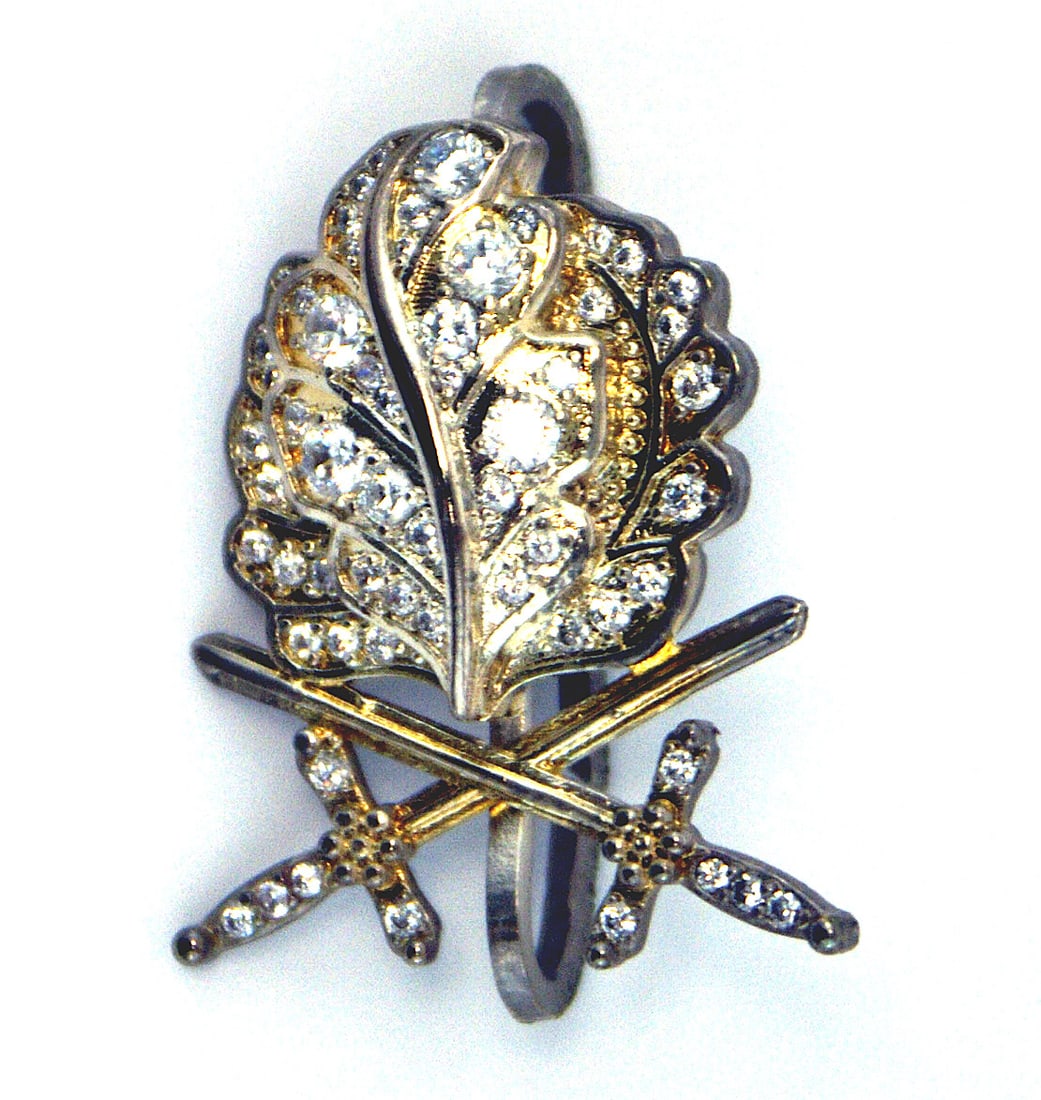German 1957 Oak Leaves Swords Brilliants: B-116 German 1957 Oak Leaves, Swords and Brilliants. Made for the WWII Knights cross recipients who lost or never received this higher award. Silver Leaves and swords have a slight gilt patina. (Diamo