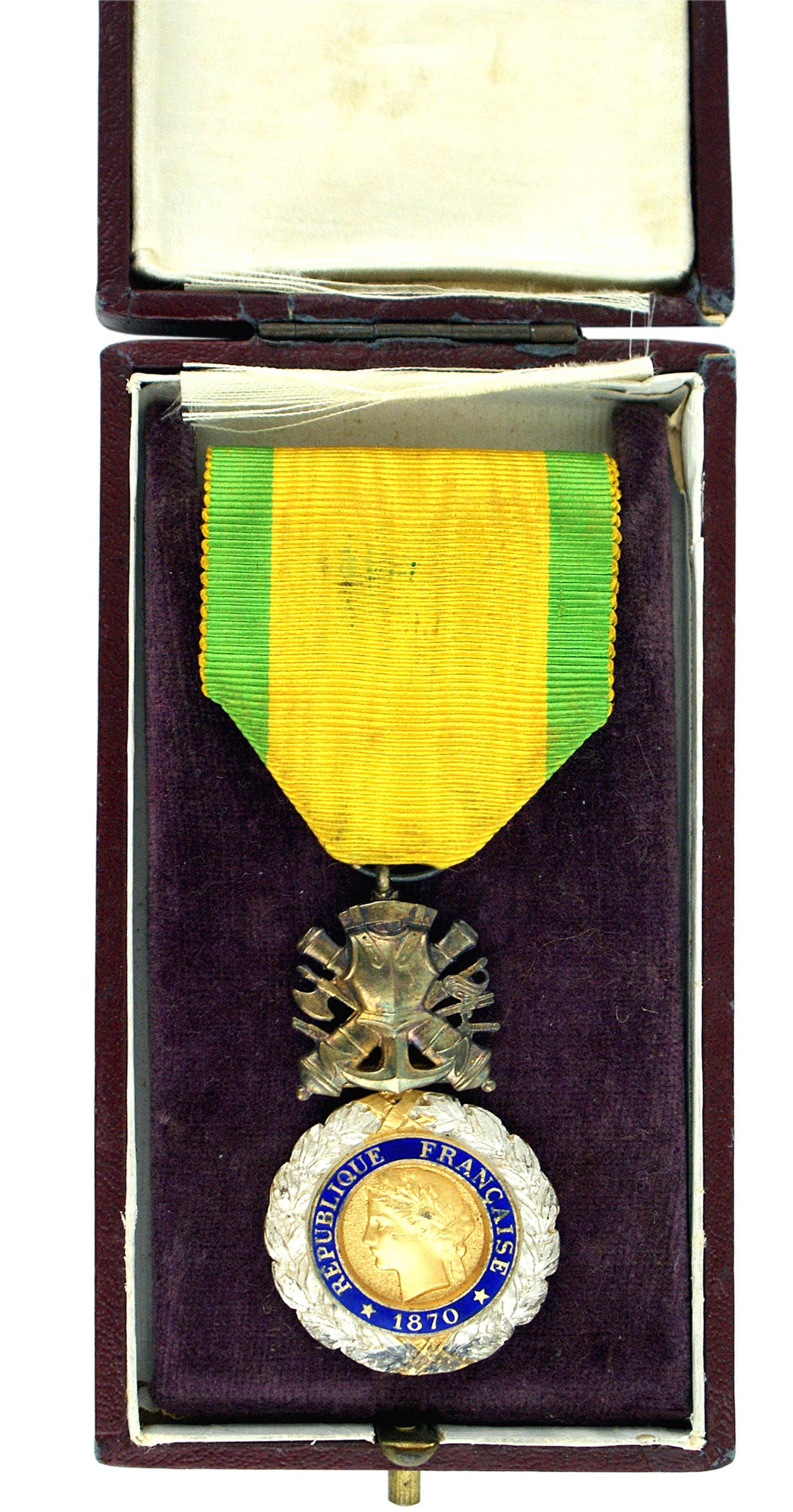 France Military Medal 1870 Discipline: B-133 France. Military Medal 1870. Circular silver gilt laurel wreath. Gilt center medallion is a side profile of a classic female head within a blue enamel band with "1870 REPUBLIC OF FRANCE". Revers