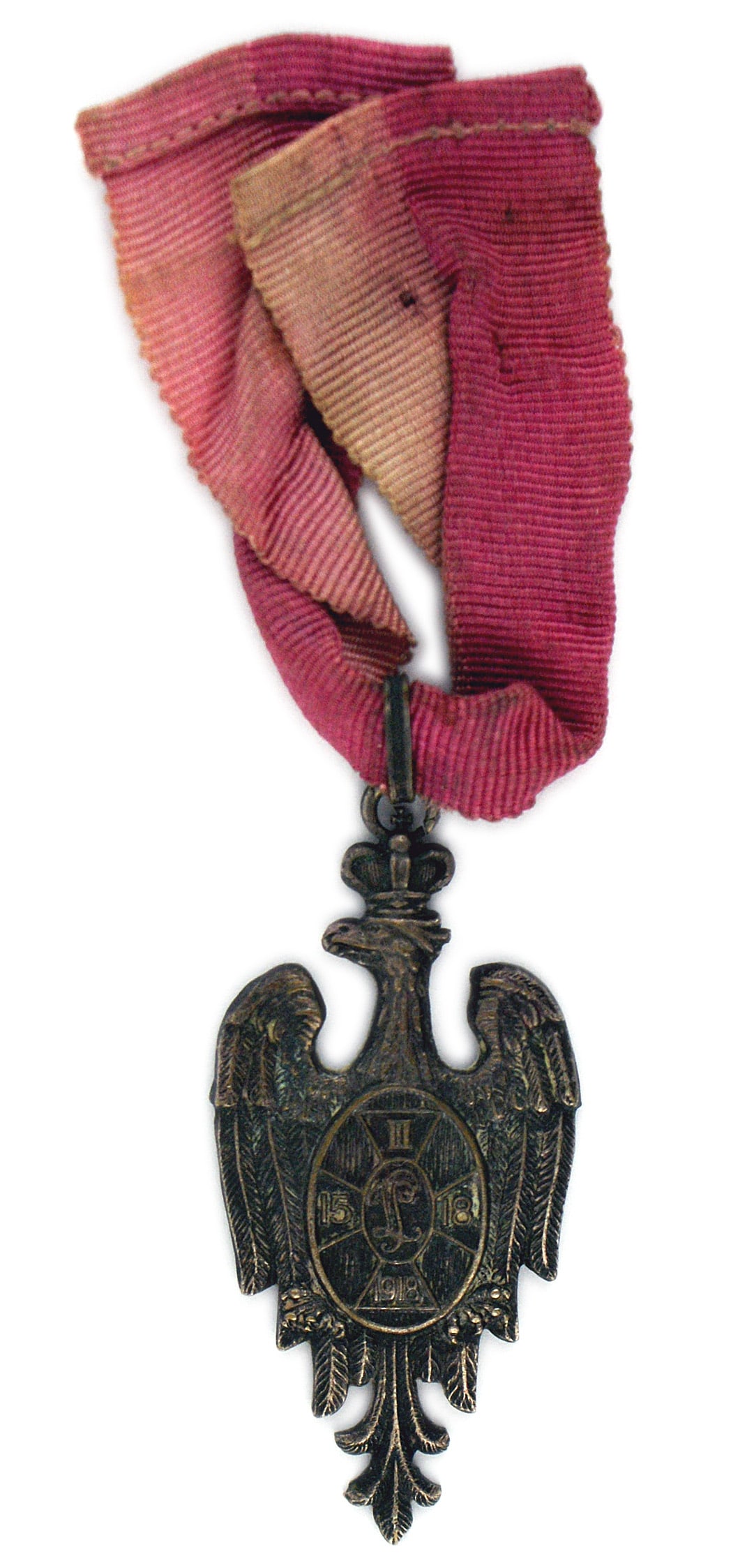 Poland WWI Prisoner of War Medal: B-182 Poland. WWI Prisoner of War Medal. Awarded to all prisoners in Hungary. Crowned Polish eagle with oval shield bearing an insignia of the second Joseph Pilsudski Brigade. Reverse has names of cit