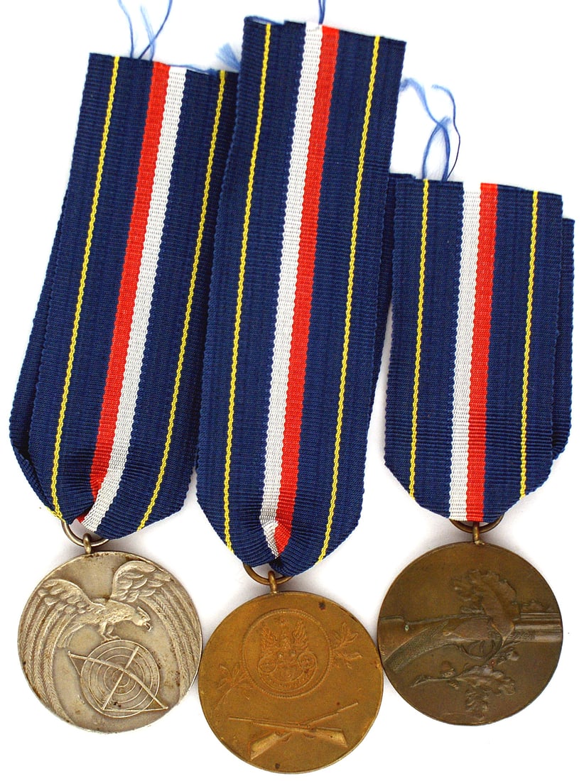 3 Poland Marksman awards 1932 1933: B-191 Poland. Lot of 3 Marksman's awards - Silver for 1932 and two Bronze for 1933. All different and engraved with the name and scoring statistics. New ribbons. I