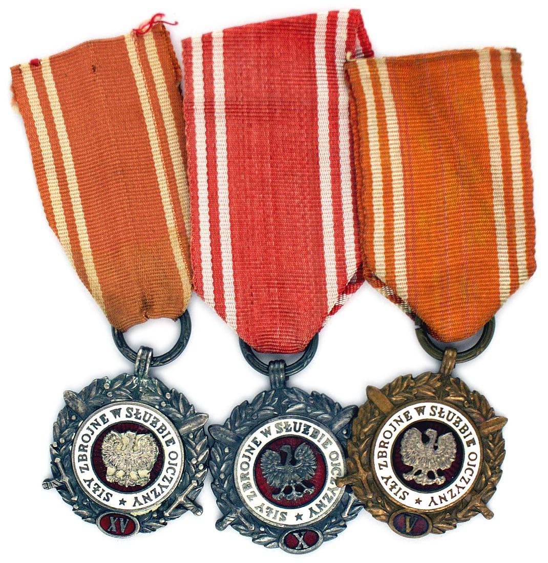 Poland 3 levels of the Meritorious Medal for Teachers: B-193 Poland. Lot of three levels of the Meritorious Medal for Teachers; (1) Five-year award. Bronze wreath of palm branches with crossed swords. White and red enameled disc with a Polish eagle mounte