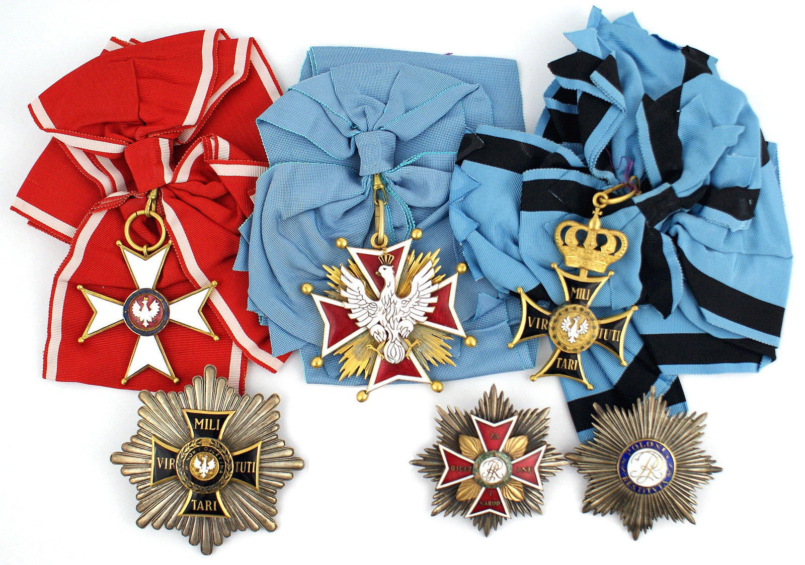 Copies of Polish Orders Grand Cross VIRITUTI: B-204 Display of excellent copies of Polish Orders. Included are: (1) Order of the White Eagle. Grand Cross size. Crowned white enameled eagle affixed to a red/white borders cross on a gilt sun burst.