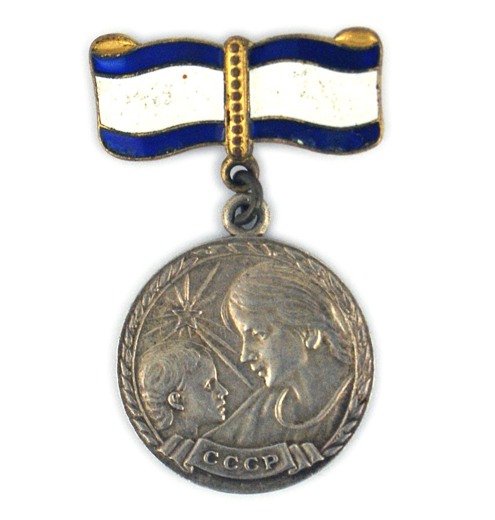 Soviet Russia MOTHERHOOD MEDAL Silver: B-223 Soviet Russia "MOTHERHOOD MEDAL". Silver. Obverse mother and child with "CCCP". Medal is suspended from a blue and white enamel bow. Instituted in 1944. Awarded for having six children. II