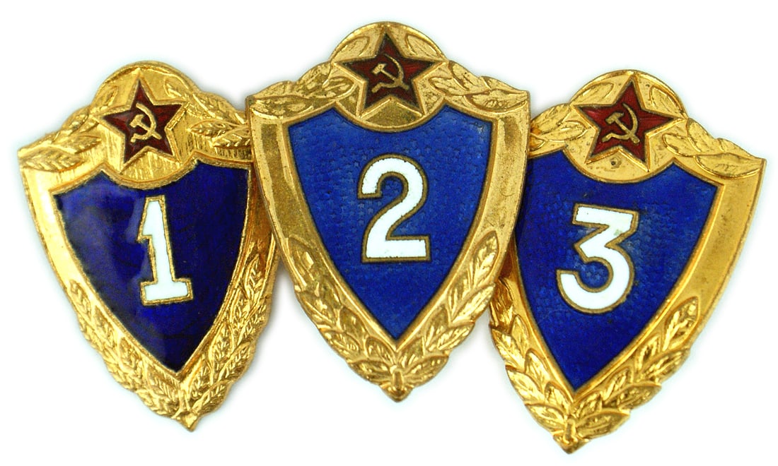 3 Russia Specialist Badges: B-224 Soviet Russia lot of 3 Specialist Badges. Gilt border on a blue enameled shield and the numbers 1, 2, 3 in white enamel. One with a pin on reverse and two with a post (one spinner is missing). I