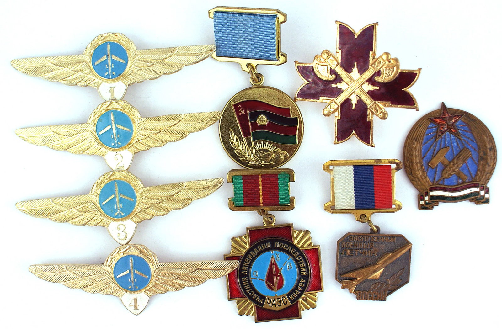 Lot of 4 Soviet Russian gilt wings: B-229 Lot of 4 Soviet Russian gilt wings with an aircraft in center and white shield with numbers "1", "2", "3" and "4". Also lot of 5 "Soviet Bloc" badges - Czech, Bulgaria, Hungary and two unknown. 