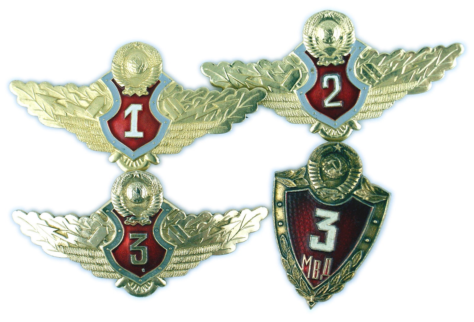 Lot of 4 Soviet Russian Specialist Badges: B-230 Lot of 4 Soviet Russian Specialist Badges: One red enamel shield shape with "3" and three wing type with red enamel and numbers "1", "2" and "3". II