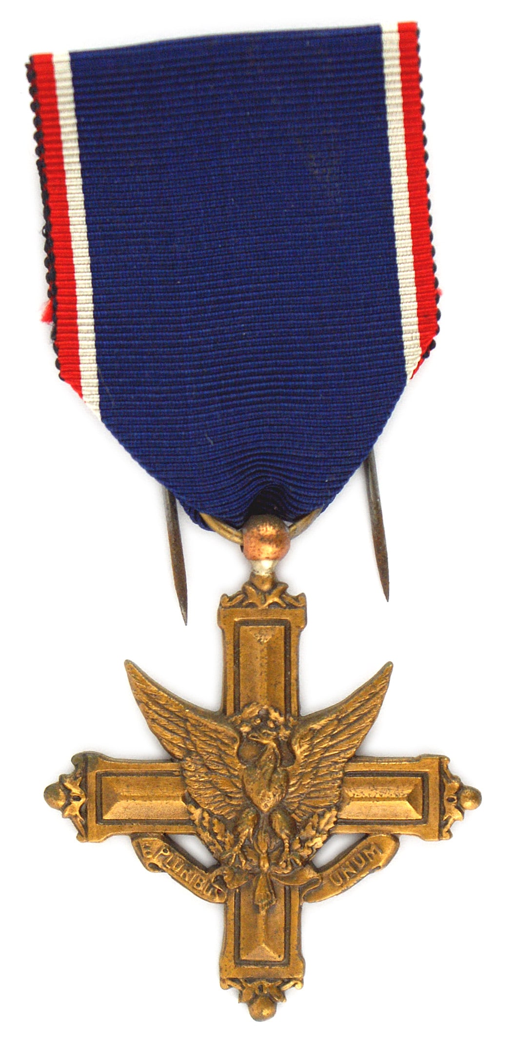 US WWI Distinguished Service Cross: B-239 United States WWI Distinguished Service Cross. American eagle on a bronze cross. Made in France. Second style with "E Pluribus Unum" on the obverse scroll. Ribbon has the French style double pin