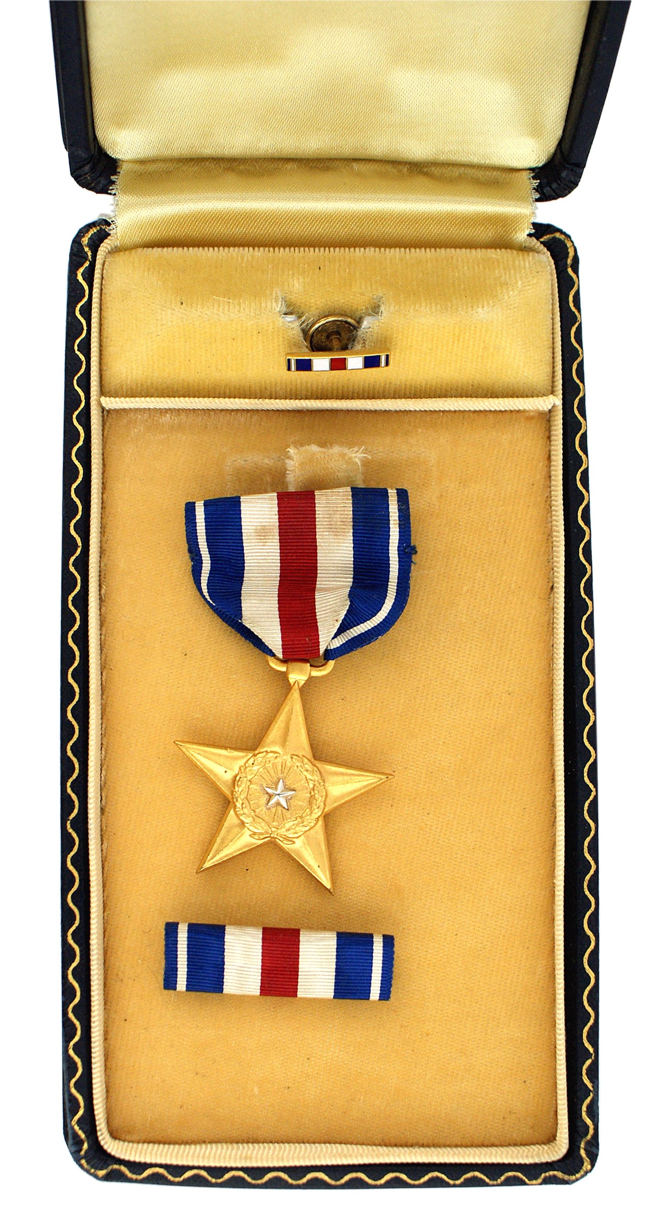 United States WWII Silver Star: B-245 United States WWII Silver Star. Five pointed gold star with a center laurel wreath holding a silver star. Reverse: "FOR GALLANTRY IN ACTION". Not named, but with serial number "52454" on edge of
