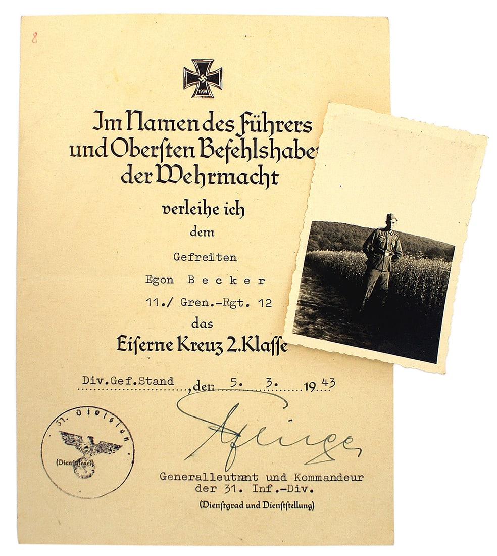 German WWII citation for the Iron Cross 2nd Class: C-006 German WWII citation for the Iron Cross 2nd Class presented to "Gefreiten Egon Becker - II. /Gren. - Rgt 12" on "5. 3. 1943". Ink stamped with an eagle/swastika and "31 Division". Signed in ink 