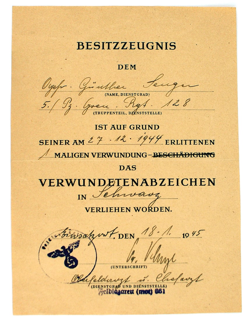 German WWII certificate Black Wound Badge: C-011 German WWII certificate for a Black Wound Badge. Awarded to a member of the 5th Panzer Grenadier Regiment 128 for wounds received 12. 27. 1944. He was attended to by the head physician of "Motor