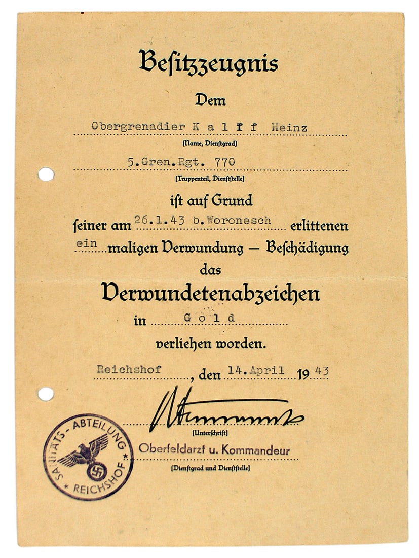 German WWII certificate Gold Wound Badge: C-013 German WWII Certificate for a Gold Wound Badge. Awarded to a member of the 5th Grenadier Regiment 770, on 26. 1. 43 for actions near Woronesh. Signed by the Cammander and head doctor of the SA M