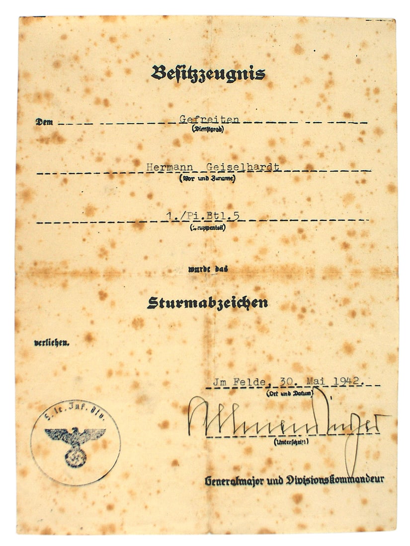 German WWII certificate for Assault Badge: C-014 German WWII certificate for an Assault Badge. Awarded to a member of "1./Pioneer Battalion 5". Dated 30 May, 1942. Signed by Gen. Maj and Division Kommandeur. Ink stamped "5. Le. Div.". Foxed II