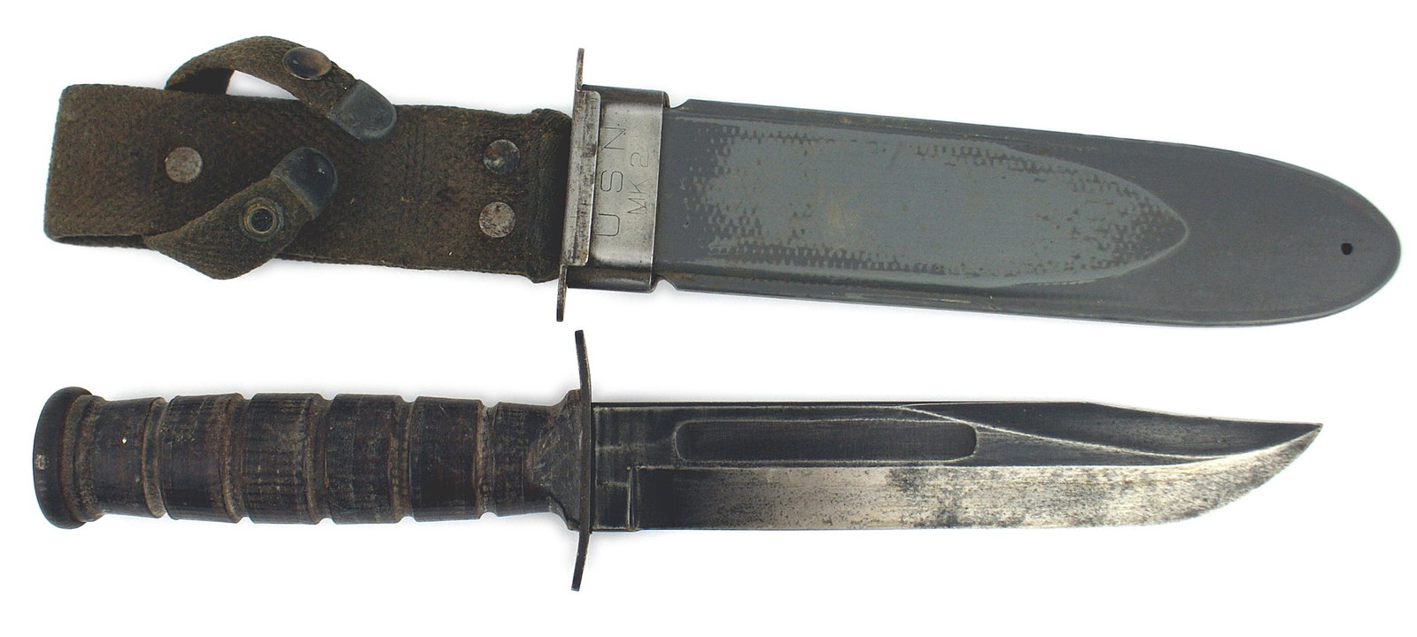 US WWII Navy Mark 2 knife: D-033 US WWII Navy Mark 2 knife. 7" blade shows some wear but retains approximately 50% of the bluing. Crossguard is marked "USN - MARK 2" and "CAMILLUS, N. Y. "Leather washer grip and a flat iron pom