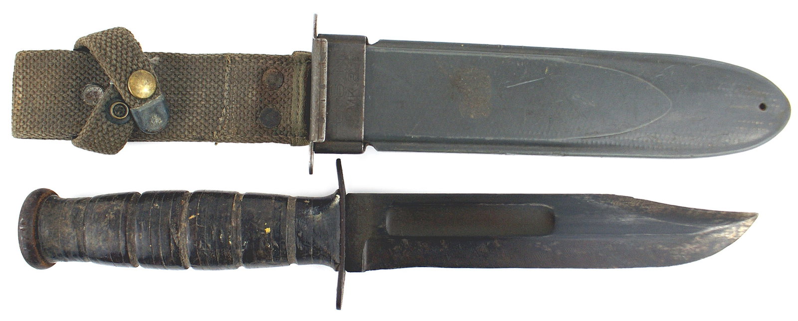 US WWII Navy Mark 2 knife: D-035 US Navy WWII "MARK 2 Knife". Five grooves leather washer handle. Ferrel area is stamped "76". Crossguard is marked "KA-BAR" and "USN MK2". Blade has darkened. Type 2 gray plastic scabbard with h