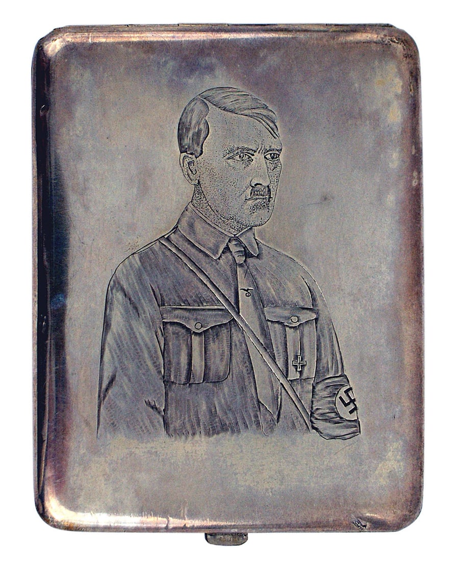 German WWII Adolf Hitler silver cigarette case: A-001 Adolf Hitler silver cigarette case. The obverse bears an unusual fully engraved portrait of Hitler wearing a "brown shirt", Iron Cross, armband and eagle/swastika tie pin. Well done with a 3-dim