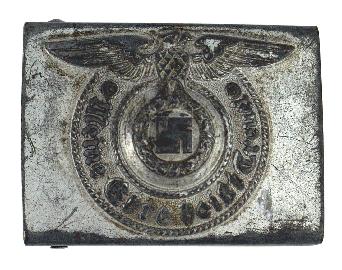 German WWII SS EM belt buckle: H-002 German Third Reich SS E.M. belt buckle. Relief eagle/swastika and "Meine Ehre Heisst Treue". Has some wear to the gray finish on the highlights on the eagle/swastika and motto, as well as the to