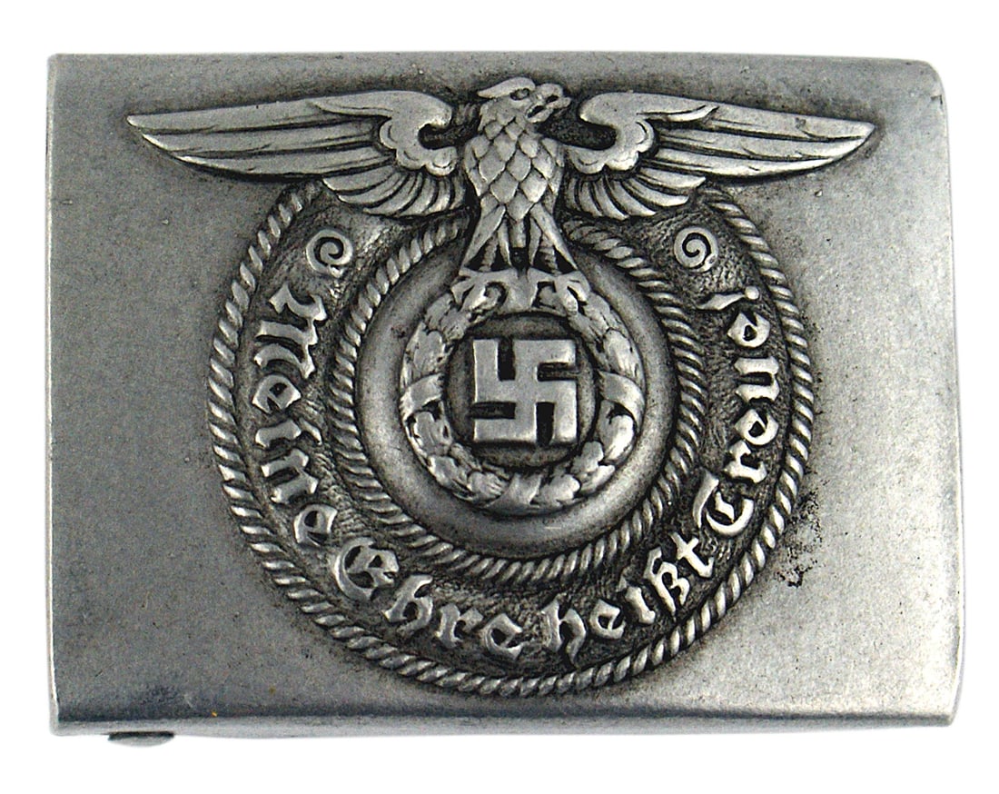 German WWII SS EM aluminum belt buckle: H-003 German Third-Reich SS E.M. aluminum belt buckle. Relief eagle/swastika in wreath on upper part of roundel with "Meine Ehre heisst Treue!". Reverse is marked "RZM 36/40 SS" II