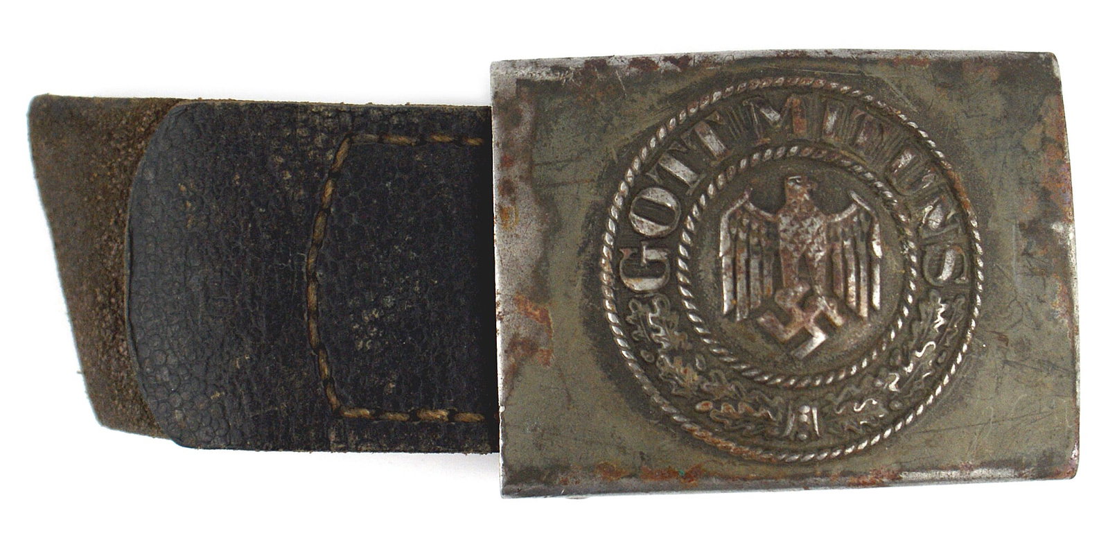 German WWII Army EM steel belt buckle: H-005 German Third Reich Army E.M. steel belt buckle. High relief eagle/swastika/oak leaves and "GOTT MIT UNS". 50% of the early light green finish remains. Reverse marked "1940". With a leather tab, 