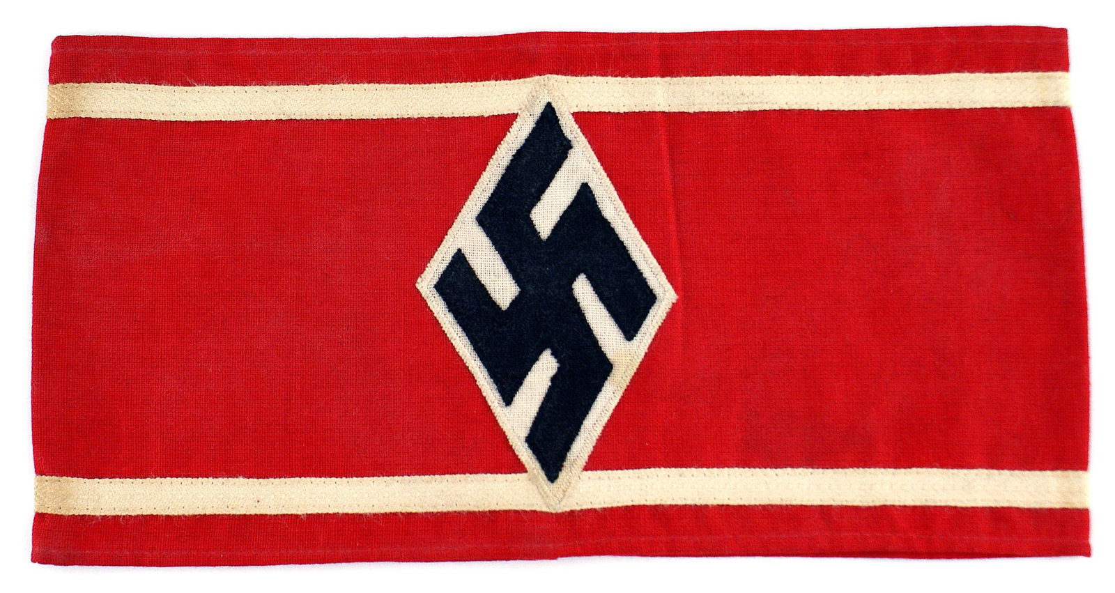 German WWII Studentenbund armband: H-015 German Third-Reich Studentenbund armband. Black cloth swastika sewn within a 3 3/4" x 2" white diamond, sewn to the center of a red band. 5/8" wide white stripe sewn along the upper and lower bo