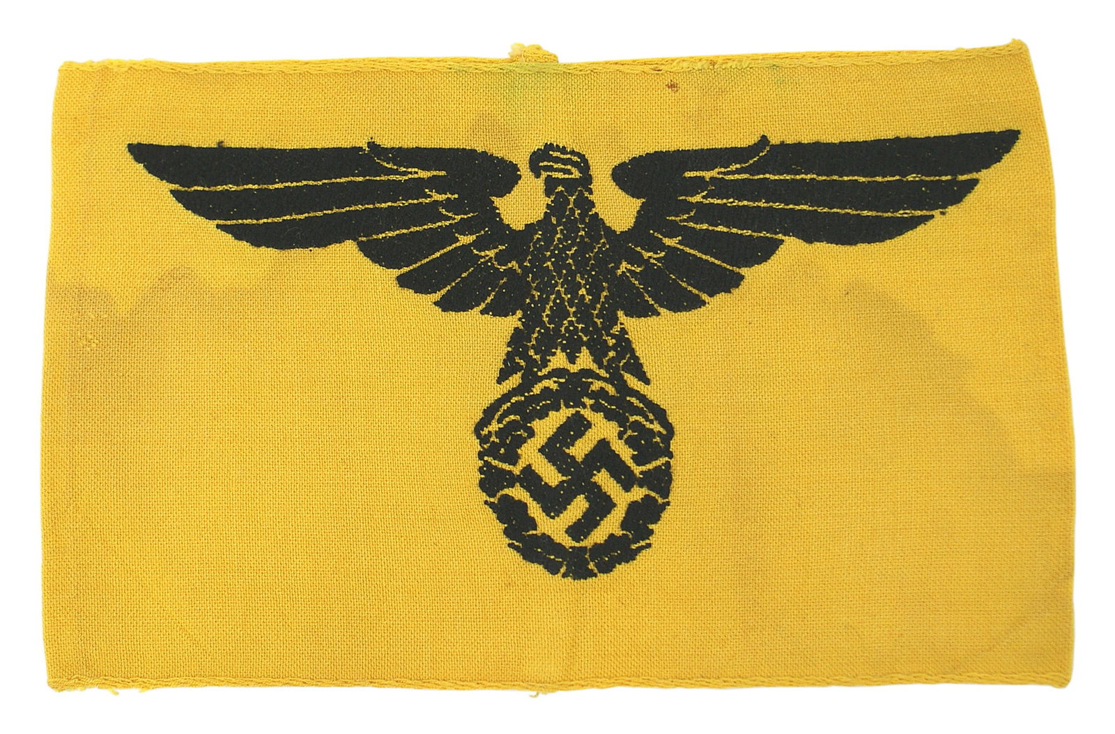 German WWII State Service armband: H-016 German Third-Reich State Service armband. Large black embroidered eagle/swastika on a yellow-gold cloth band. Lightly soiled. About II