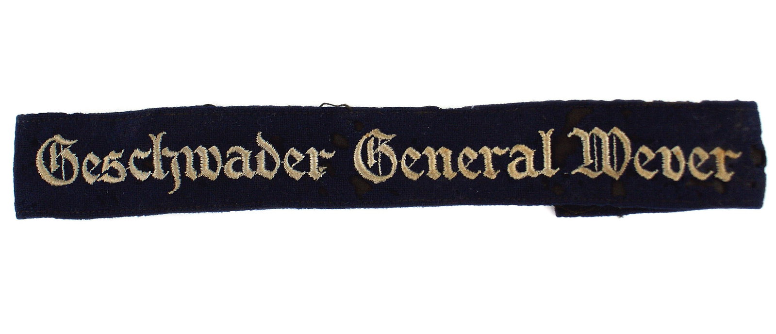 German WWII Luftwaffe General Wever cufftitle: H-024 German WWII Luftwaffe "Geschwader General Wever". Lettering embroidered in silver-gray thread on a dark blue cloth band. Originally ordered to be worn by members of Kampfgeschwader Gotha in reme