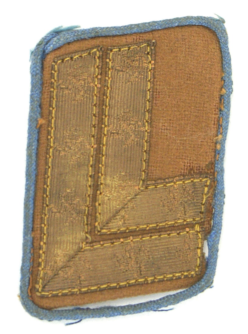 German WWII NSDAP Ortsgruppe level collar tab: H-026 Third-Reich N.S.D.A.P. single right side, collar tab. 2nd pattern 1934 - 36 Ortsgruppe level - light brown with light blue piping and two "L" shaped gold bars with interwoven swastikas. "RZM" pa