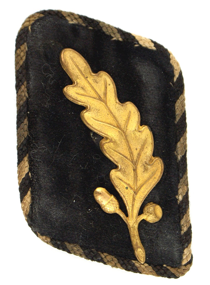 German WWII 1934 SA Niederrhein collar tab: H-035 Third-Reich 1934 SA Standarten fuhrer of Group Niederrhein single right collar tab. Black tab with a gold metal oak leaf and black/white cord piping. Leaf is II+, Tab is II-