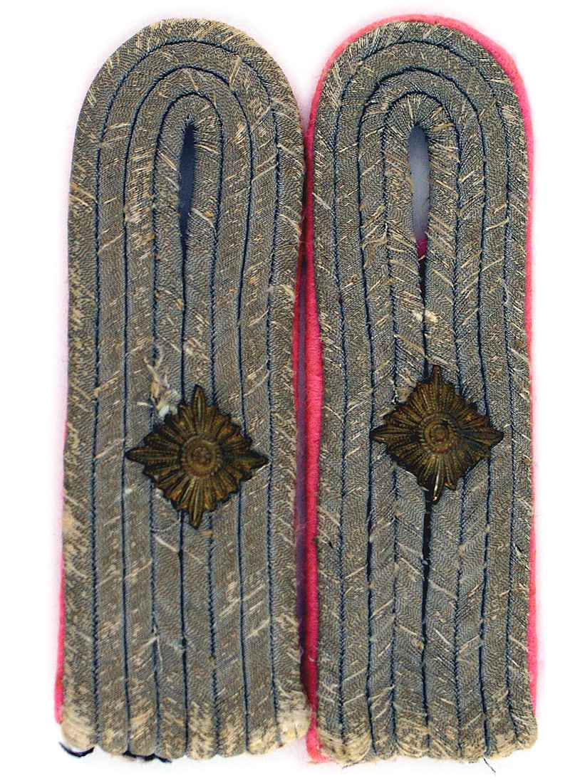 German WWII Panzer 1st Lt shoulder boards: H-038 German WWII Panzer 1st Lieutenant sew-in shoulder boards. Silver-gray cords with pink piping/underlay. Show wear, were removed from a tunic. II-