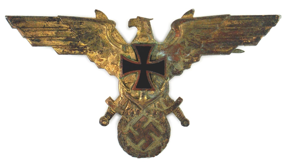 German WWII NSRKB breast eagle: H-043 Third-Reich N.S.R.K.B. (National Socialist War Association) 1st type uniform breast eagle. 2" x 3 3/4" gilt metal eagle with a large black enamel Iron Cross. Some bright gilt remains on the age 