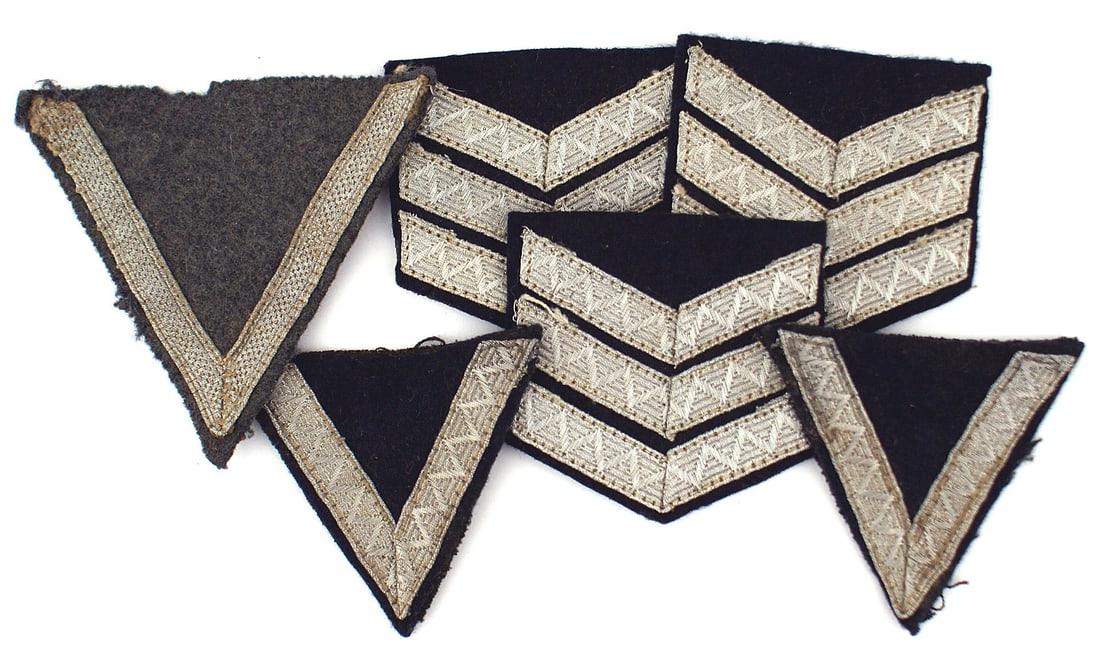 German WWII chevron insignia Youth Luftwaffe: H-045 Lot of German Third Reich chevron insignia: (1) Two DJ (German Youth) "Hordenfuhrer" sleeve ratings. Silver tress on a dark blue "V". (2) Variant three inverted silver tress V's on dark blue. (3