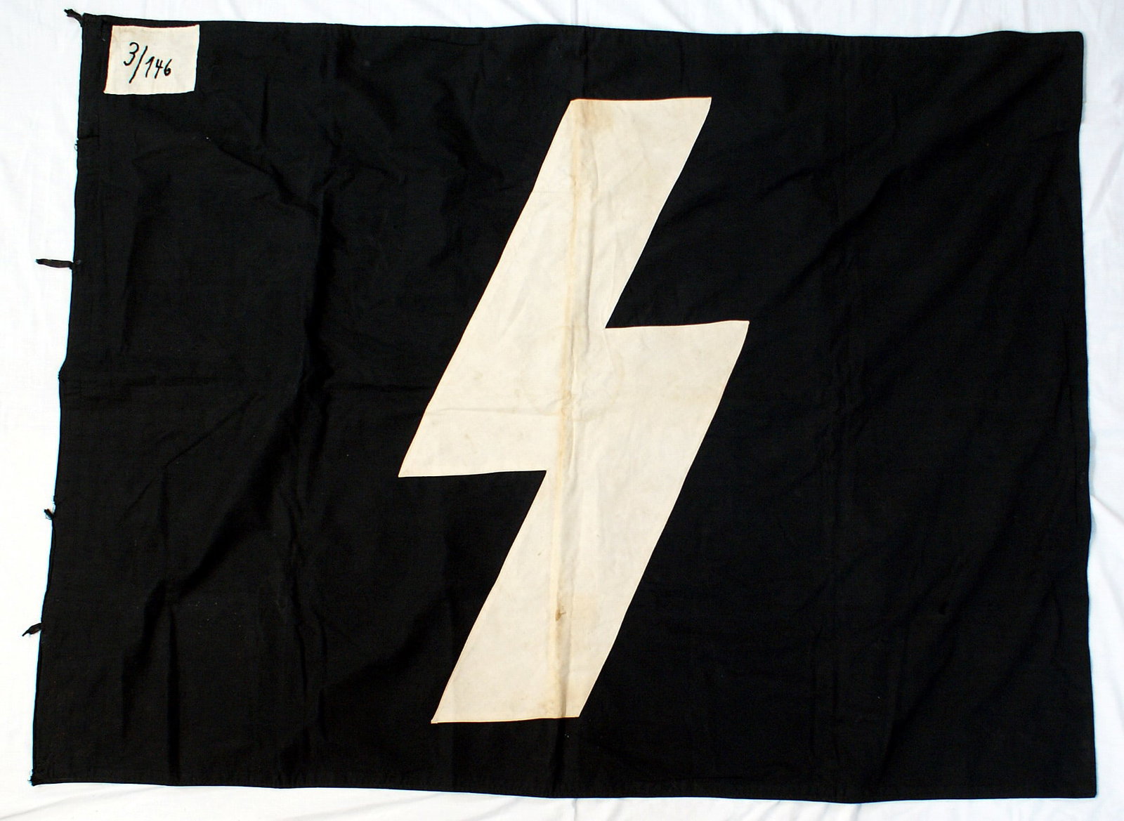Germany WWII DJ Youth Unit flag: H-061 Germany Third - Reich D.J. (German Youth) Unit Standard for Gebeit 3, Bann 146. Large 35 x 18 white lightning bolt sewn to a black background. 5 1/2" x 8" white "patch" in upper corner with blac