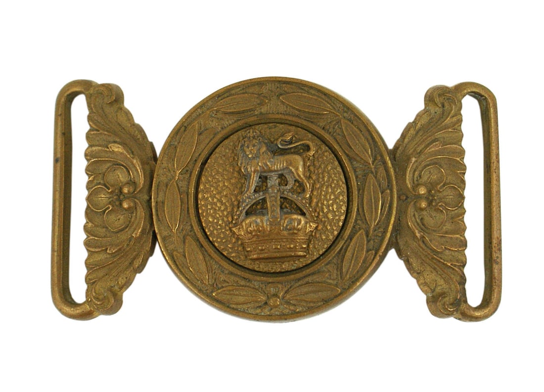 British circa 1910 officer belt buckle: H-090 British circa 1910 officer's two piece brass belt buckle. Stippled roundel with an affixed lion/crown. Laurel wreath decorated background round fitted half - both pieces with relief floral decor