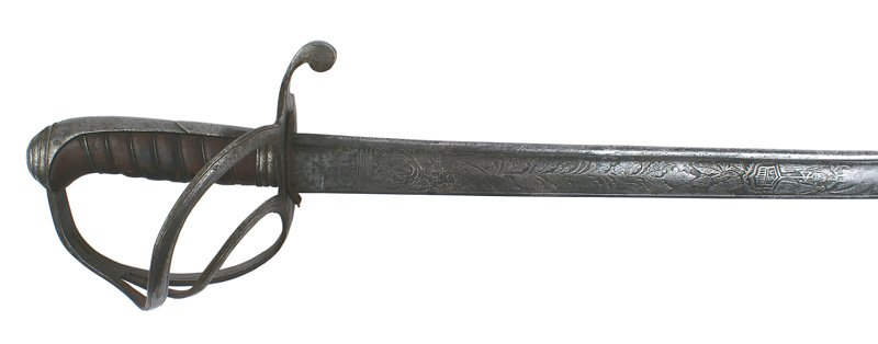 U.S. Topographical Engineer sword M1839: K-12 U.S. Topographical Engineer's sword M 1839. Wire wrapped leather grip, iron back straps and 3 branch guard similar to the 1833 Dragoon sword. 35 5/8" slightly curved blade. Engraved with relief f
