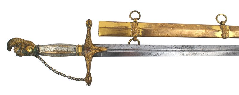 U.S. Militia Officer presentation sword Circa 1840: K-13 U.S. Militia Officer's presentation dress sword - Circa 1840. Helmeted Roman soldier pommel. 50% of the gilt finish remains. Silvered floral engraved metal grip (wear on the edges). Gilt crossgua